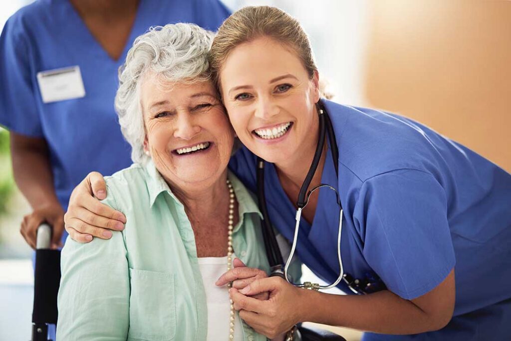 Family members review a care plan with an older adult at a comfortable assisted living table.